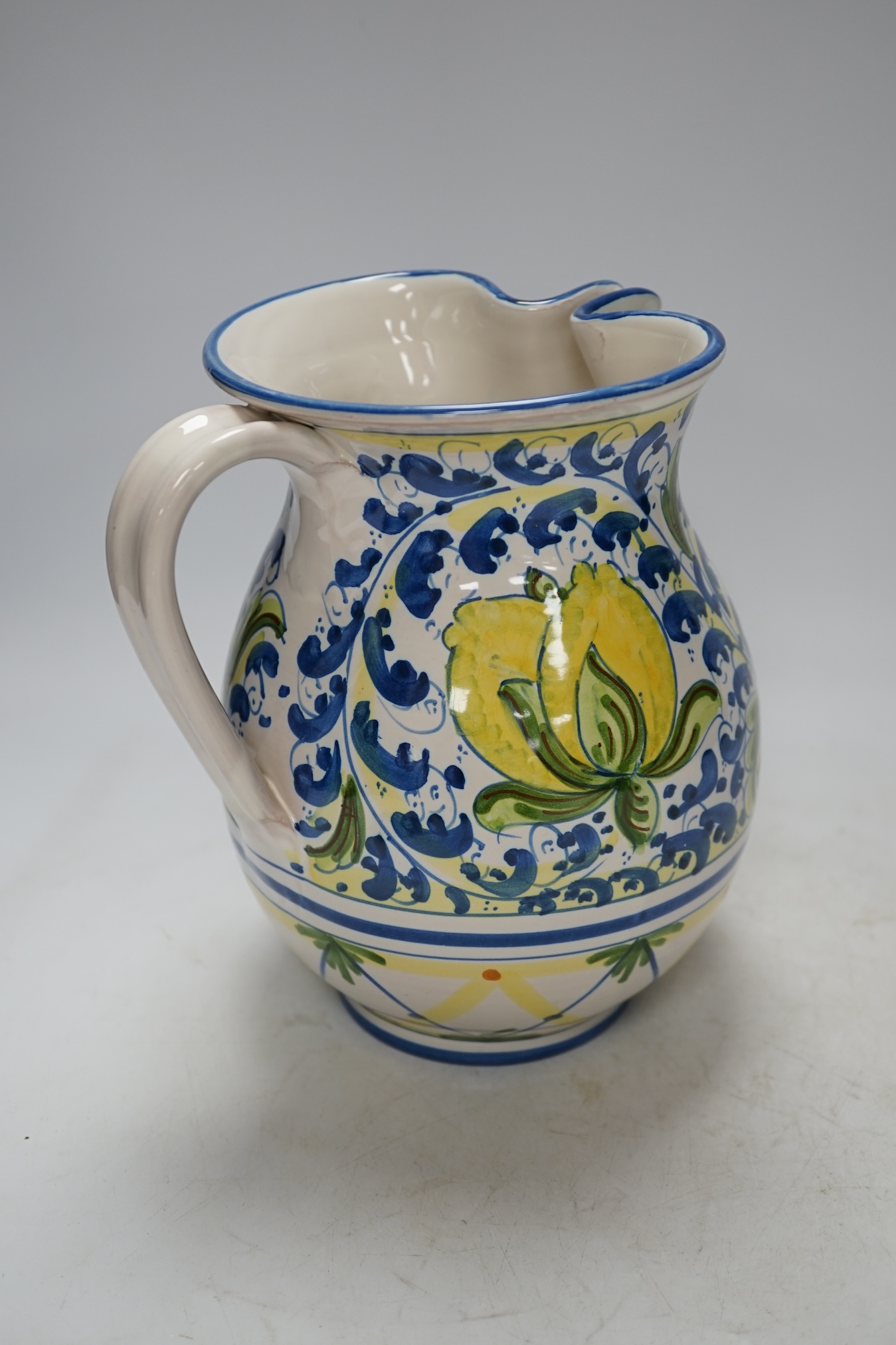 From the Studio of Fred Cuming. An Italian maiolica ‘lemons’ jug, 20cm high. Condition - good